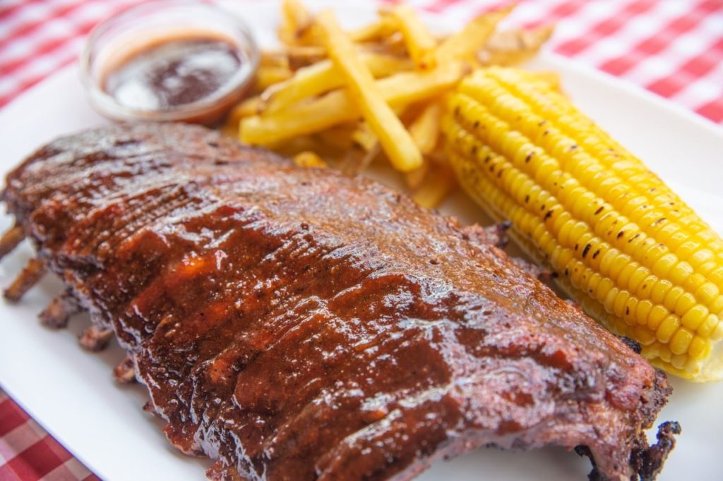 Ribs, fries and corn on the cob at Bella's Pizzeria restaurant in Siem Reap