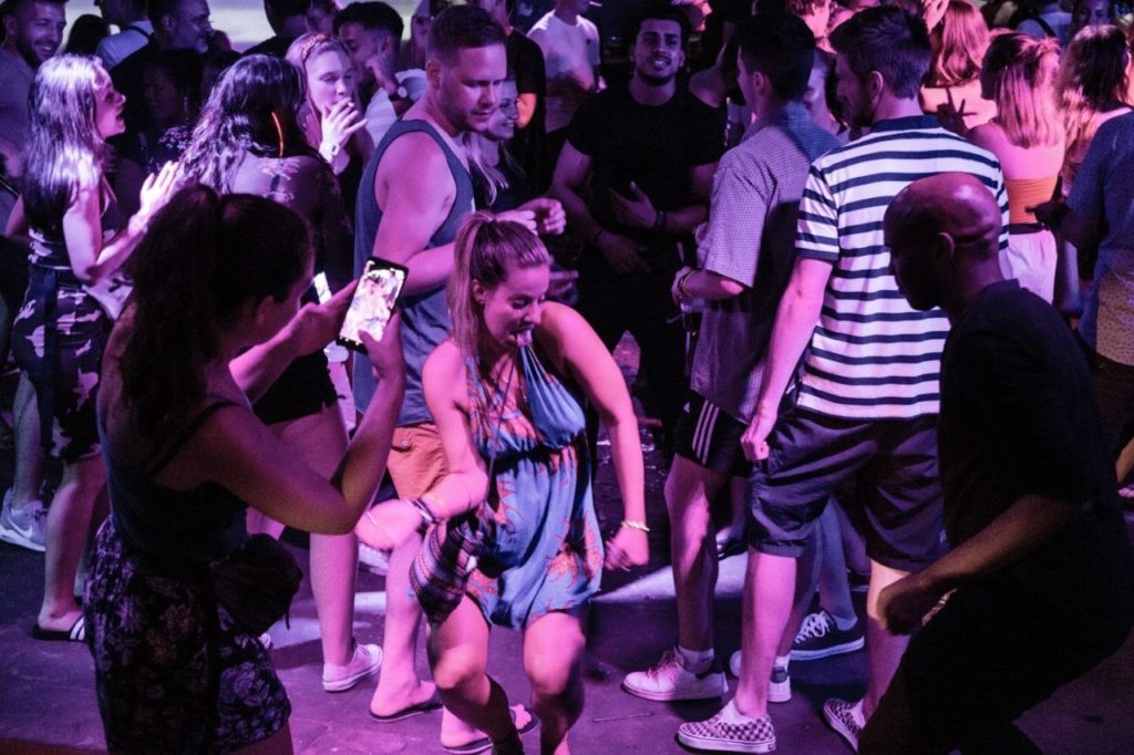 Tourists dancing at X Bar, the rooftop bar on Pub Street near Angkor Wat