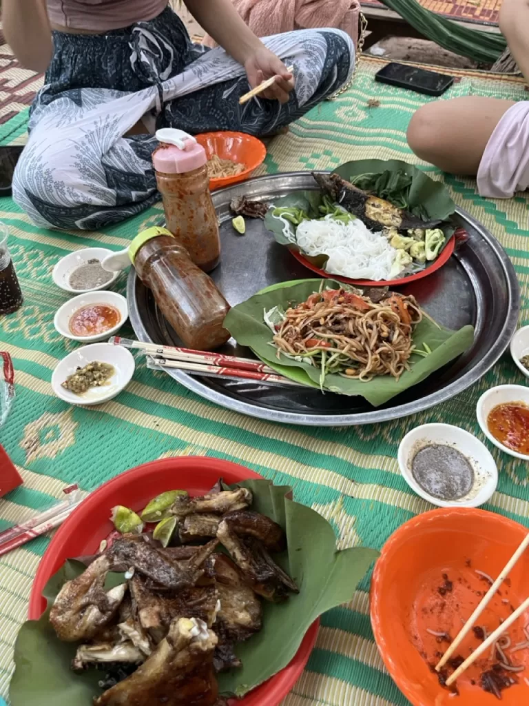 Prahok sauce being enjoyed in the Angkor Wat Archaelogical Park with chicken, noodles and vegetables