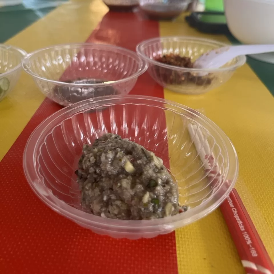 Freshly served Prahok paste in a dish ready to be served as a dip