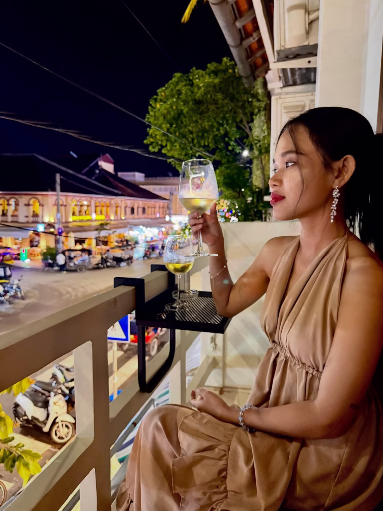 Khmer woman drinking a cocktail with the low cost of living and Siem Reap